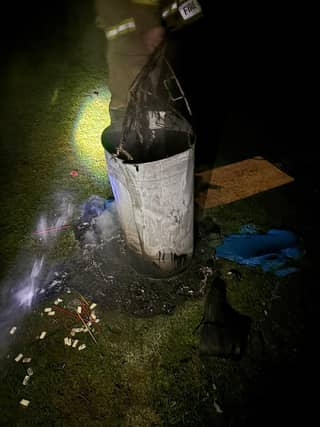The bin was set alight, damaging the pitch.