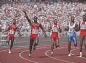 Left - right  Desai Williams look across at Ben Johnson of Canada #159 who holds his arm aloft in victory over Calvin Smith of the USA, Linford Christie of Great Britain and Carl Lewis of the USA at the finish of the Men's 100 Metres final race at the XXIV Summer Olympic Games on 24 September 1988 at the Seoul Olympic Stadium in Seoul, South Korea. Ben Johnson will be disqualified after winning the gold for taking performance drugs. (Photo by Mike Powell/Allsport/Getty Images)