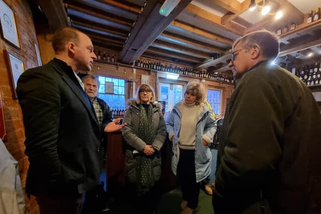 MP Matt Warman taking to residents in Wainfleet about what is being done to protect them from flooding.