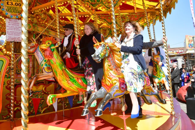 Boston Mayor and other members of Boston Borough Council try out the galloping horses.
