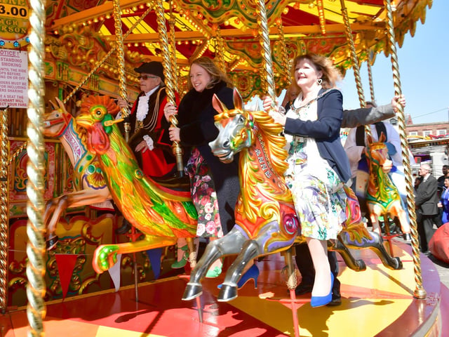 Boston Mayor and other members of Boston Borough Council try out the galloping horses.