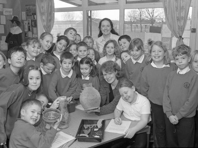 Pupils at Staniland Primary School taking a trip back in time as part of Tudor History Day. Part of the day involved looking at some relics from Tudor times with the help of community archaeologist Susan Smith (seated). Pictured with Susan are Year Four pupils and teacher Paula Dawkins.