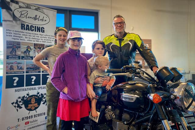Callie, Darcy, Ebony and Jonah Brady-Eldridge learn about motorcycles from Recordbreaking Blind Motorcyclist and owner of Blindbloke Racing, Nigel Limb from Sutton on Sea. Photo by Chris Frear