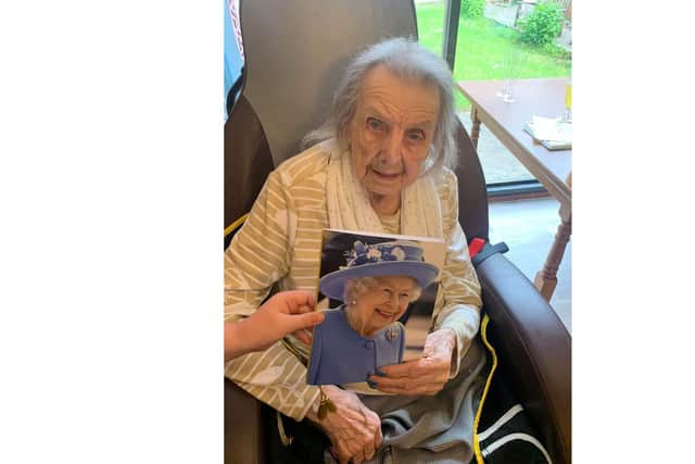 Madge with her card from the Queen