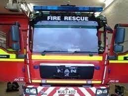 In an emergency dial 999 and ask for the fire service.