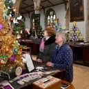 Event organiser Lesley Elliott (right) and June Barber, a fellow member of the Friends Of St James's Church group, admiring one of the Christmas trees on display. (PHOTO BY: D.R.Dawson Photography)