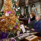 Event organiser Lesley Elliott (right) and June Barber, a fellow member of the Friends Of St James's Church group, admiring one of the Christmas trees on display. (PHOTO BY: D.R.Dawson Photography)