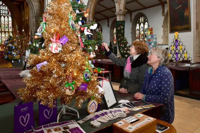 Event organiser Lesley Elliott (right) and June Barber, a fellow member of the Friends Of St James's Church group, admiring one of the Christmas trees on display. (PHOTO BY: D.R.Dawson Photography)
