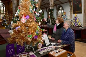 Event organiser Lesley Elliott (right) and June Barber, a fellow member of the Friends Of St James's Church group, admiring one of the Christmas trees on display. (PHOTO BY: D.R.Dawson Photography)
