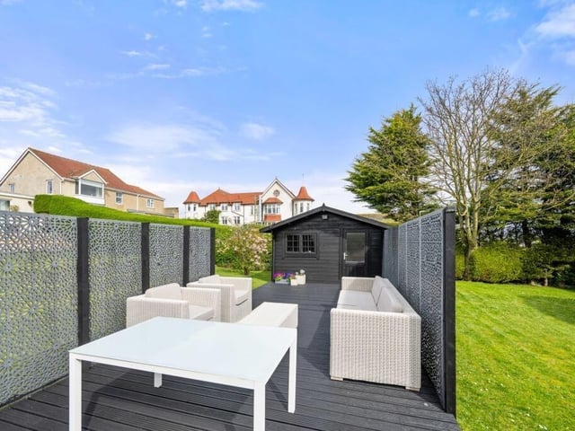 The second decked sun terrace with summer house.