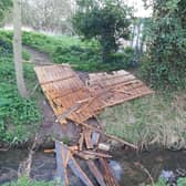 Broken fence panel dumped in the Holdingham Beck, blocking the water flow. Photo supplied