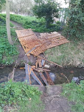 Broken fence panel dumped in the Holdingham Beck, blocking the water flow. Photo supplied