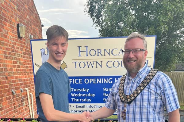 New Horncastle Town Councillor Owen Wilkinson, 18, with his dad and chairman Coun Matt Wilkinson.