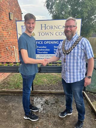 New Horncastle Town Councillor Owen Wilkinson, 18, with his dad and chairman Coun Matt Wilkinson.