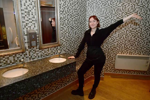 Team Leader, Patrycja Wiater in the mens loos at Moon Under The Water, Boston.