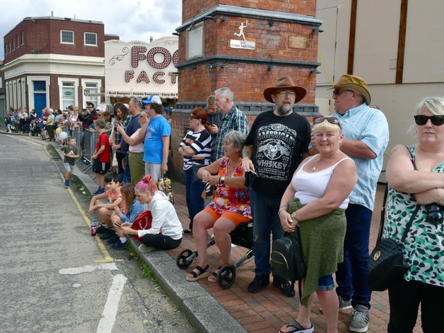 Crowds watching the parade through town.