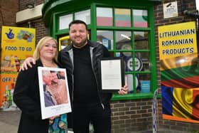 Erhan Akyuz with his wife Emma Akyuz outside his shop, which was visited by Prince Charles.