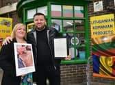 Erhan Akyuz with his wife Emma Akyuz outside his shop, which was visited by Prince Charles.