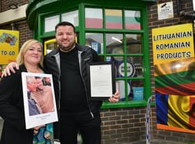 Erhan Akyuz with his wife Emma Akyuz outside his shop, which was visited by Prince Charles.