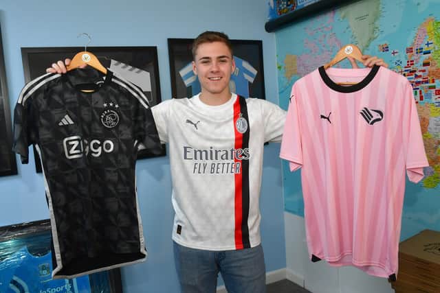 Louis wearing this season's AC Milan away shirt, holding this season's Ajax third shirt (left) and Italian side Palermo's shirt from this season.