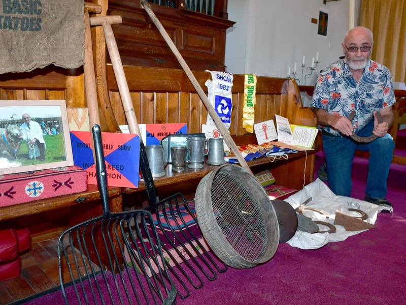 Julian Fairchild with an array of bygone tools such as a muck fork and riddle.