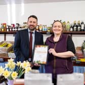 Chris Yorston, head of waste at Lincolnshire County Council, presenting Cat Shaw, co-owner at J. Shaw & Son, with her Lincolnshire loose fruit and vegetable champion certificate. Photo: LCC