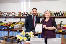 Chris Yorston, head of waste at Lincolnshire County Council, presenting Cat Shaw, co-owner at J. Shaw & Son, with her Lincolnshire loose fruit and vegetable champion certificate. Photo: LCC