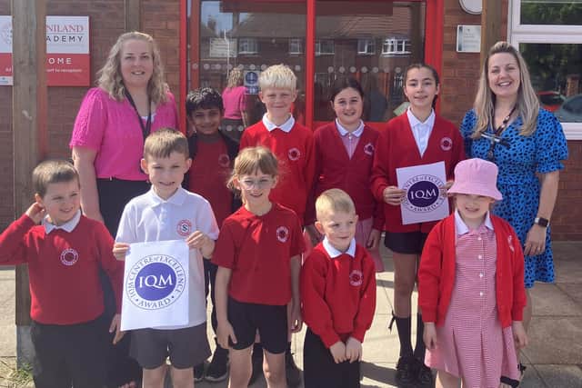 Staff and pupils at Staniland Academy, Boston, celebrating their Centre of Excellence status for inclusion.