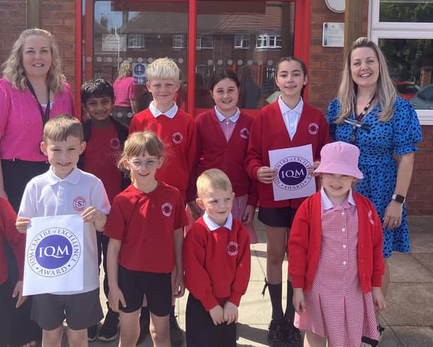 Staff and pupils at Staniland Academy, Boston, celebrating their Centre of Excellence status for inclusion.