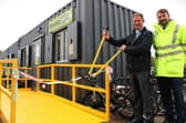 Cllr Daniel McNally and acting head of waste Chris Yorston, of Lincolnshire County Council, cut the ribbon to officially open Tattershall Reuse Shop, which comprises two recycled shipping containers.