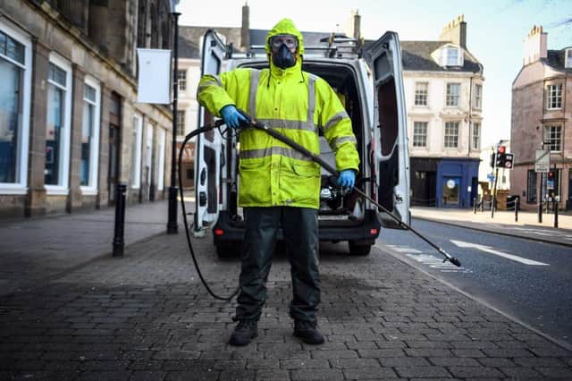 Robin Barclay, cleaning contractor, poses on a street in Glasgow (Photo: ANDY BUCHANAN/AFP via Getty Images)