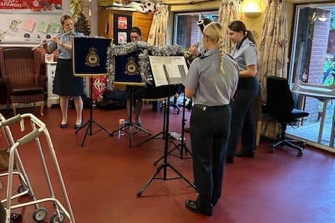 An ensemble from RAF Cranwell performs festive tunes for Ashdene care home residents.