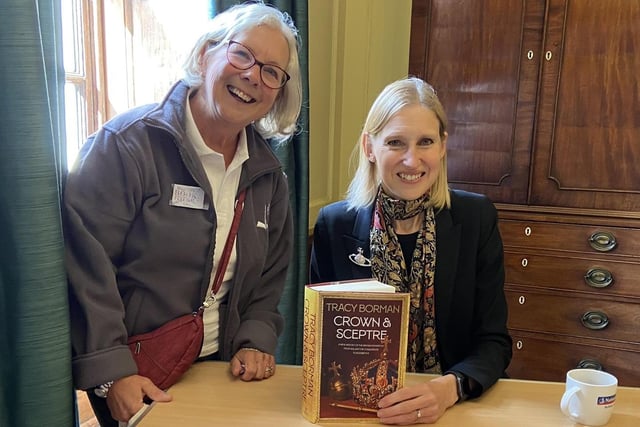 Festival volunteer Gail Cooper getting her copy of Crown and Sceptre signed by Tracy Borman.