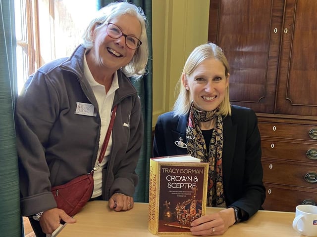 Festival volunteer Gail Cooper getting her copy of Crown and Sceptre signed by Tracy Borman.