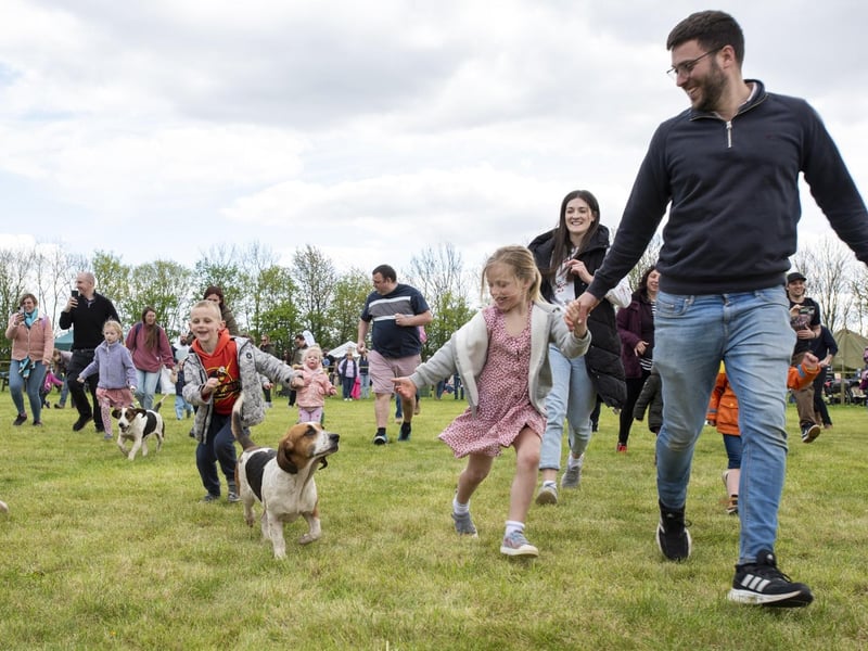 Pounding the showground with the hounds! Darcey Dickinson, aged six, and dad Ben Dickinson among those running in the East Lincs Basset Hounds race. Photo: Holly Parkinson