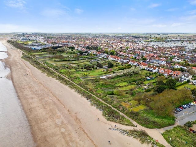 The home enjoys beach access.