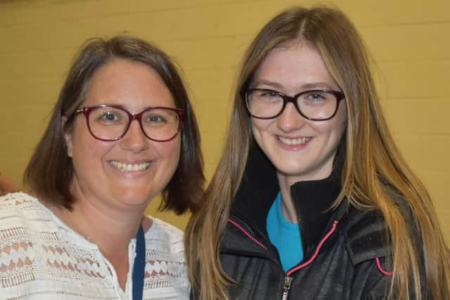 Another pupil collects their results at Haven High Academy.