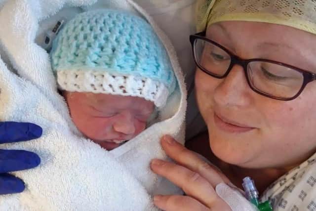 Charlotte with a newborn Charlie after her C-section.