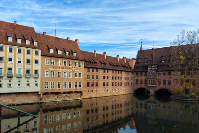 The historic Hospital of the Holy Spirit (right), standing over the River Pegnitz in Nuremberg, is now a restaurant
