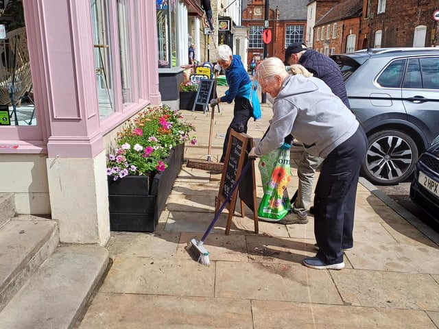 Streets were swept to clear any stray earth after planting