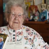 Proud Kay Raby, of Sutton on Sea, with her card from King Charles III and Queen Camilla to mark her 100th birthday.