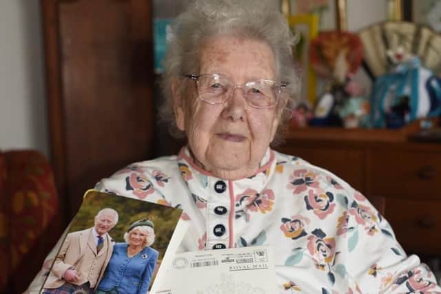 Proud Kay Raby, of Sutton on Sea, with her card from King Charles III and Queen Camilla to mark her 100th birthday.