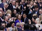 Rishi Sunak is congratulated as he arrives at Conservative party HQ in Westminster, London, after it was announced he will become the new leader of the Conservative party after rival Penny Mordaunt dropped out.
