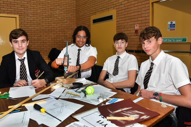 Hard at work, Carre's Grammar School team mates, from left - Zak,  Isaac,  Harry and Tom. Photo: Mick Fox