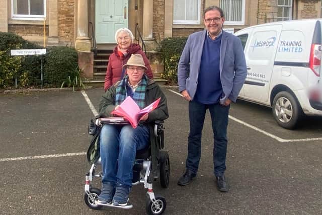 Anthony Henson (seated) has been a keen campaigner against the Market Place proposal, and gathered hundreds of signatures on multiple petitions. Photo: Yvette Henson