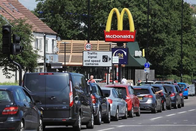 Cars queue at a Drive Thru McDonald's  (Photo by Andrew Redington/Getty Images)