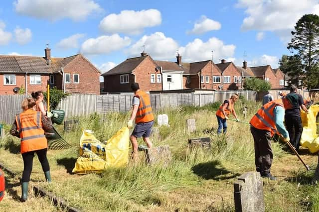 Volunteers clearing St Clements Churchyard in Skegness. Photo: Barry Robinson.