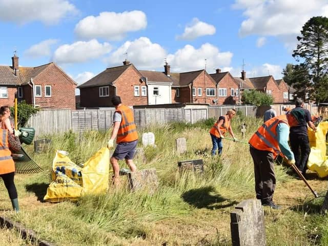 Volunteers clearing St Clements Churchyard in Skegness. Photo: Barry Robinson.