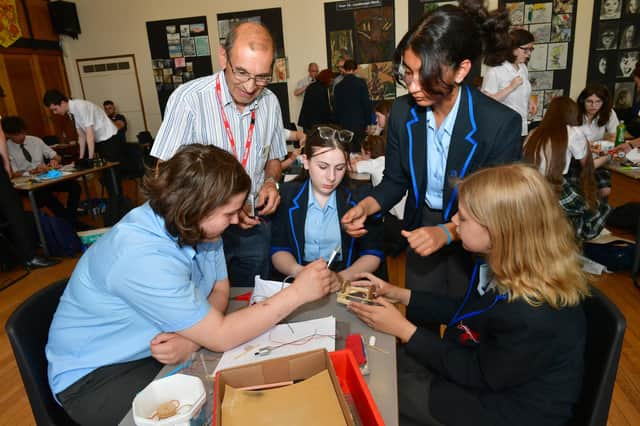 St George's Academy, Ruskington, pupils, from left - Justyna Jaworska, 12, Rhianna Kirkland, 13, Maryam Alhussainy, 13 and Alisha Robertshaw, 13 with John Webster of Sleaford Kesteven Rotary Club.