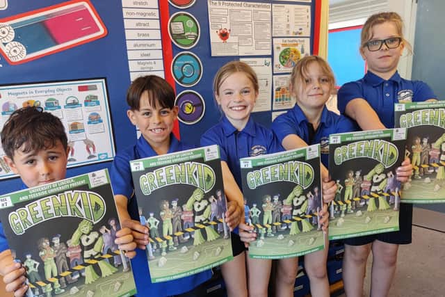 Children from Branston Junior Academy’s year 4 class. From left to right: Isaac, Max, Isobel, Brooke, and Liam receiving their latest comic.